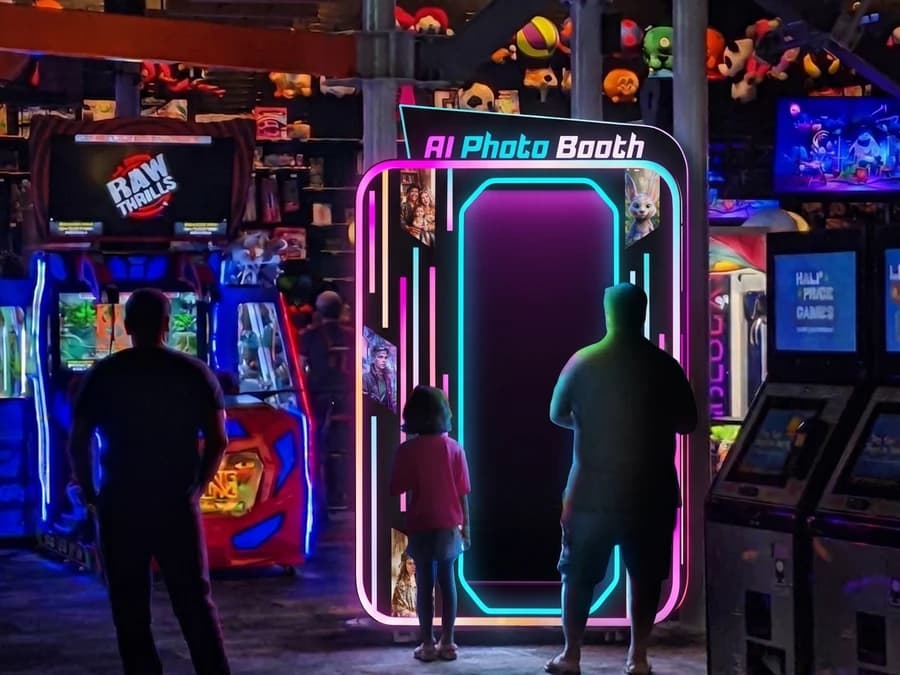 Customers using the AI photo booth machine at a shopping mall