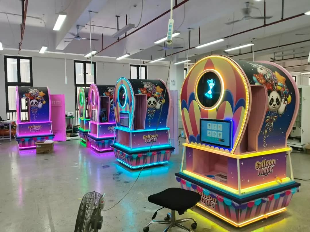 Five Balloon Magic machines lit up on the Futureino factory floor in Guangzhou