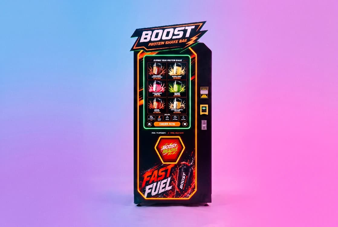 Boost Protein Shake Bar vending machine installed and running in a live venue, showing its touchscreen menu