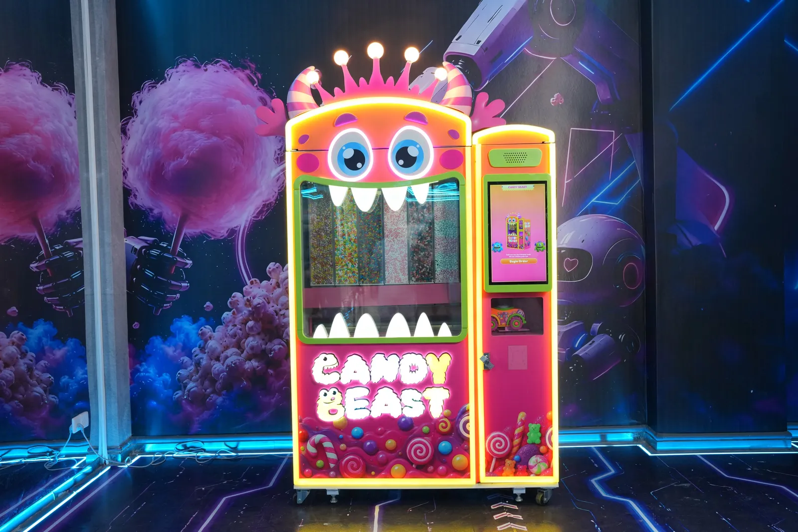 Candy Beast machine glowing in a dark neon showroom