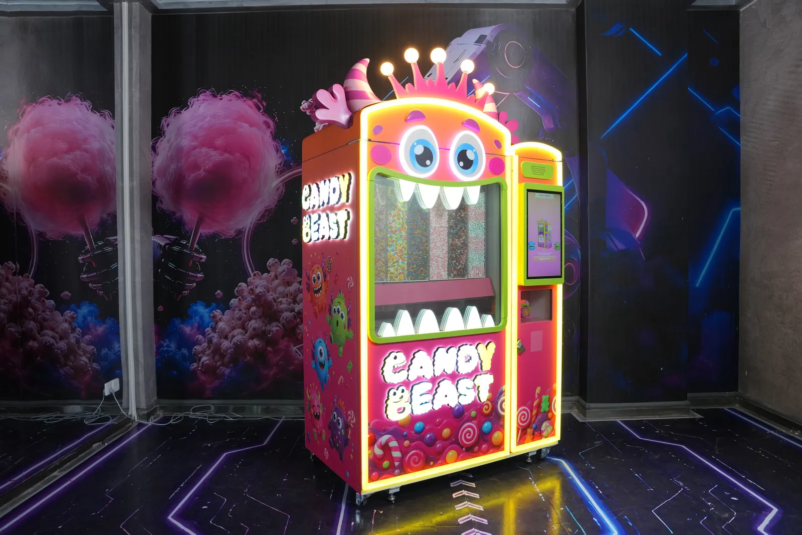 Angled view of the Candy Beast machine with LED lighting in the showroom