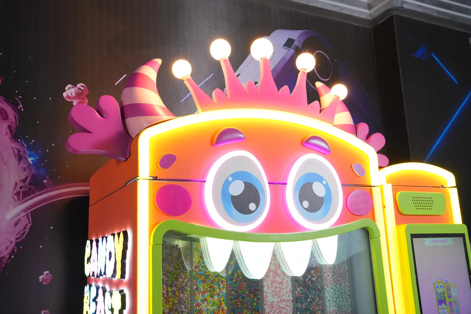 Close-up of the Candy Beast monster face with its glowing crown