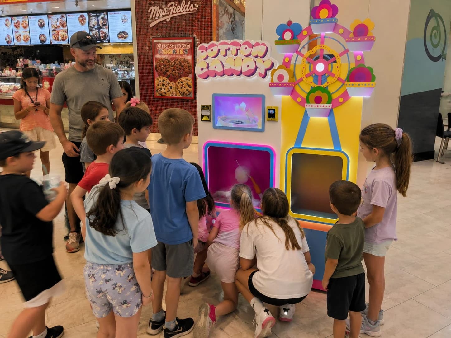 Futureino cotton candy robot surrounded by customers