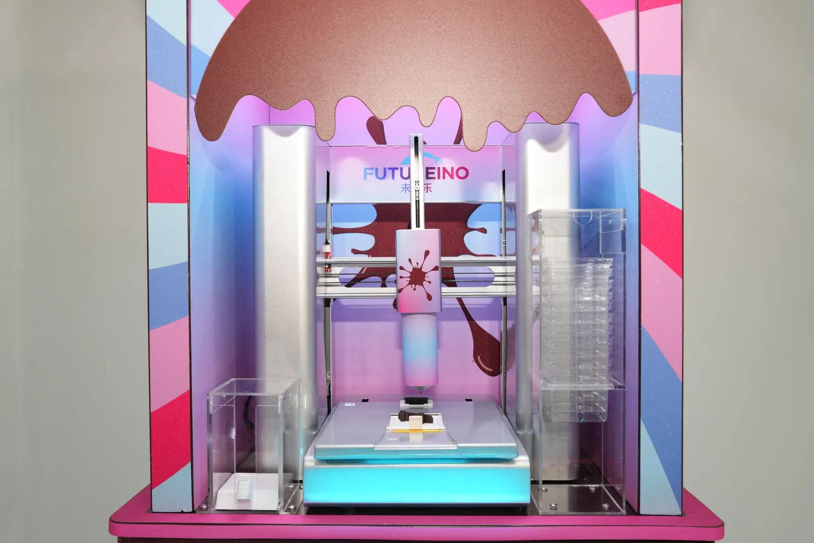 ChocoArt chocolate printer under its melting-chocolate canopy