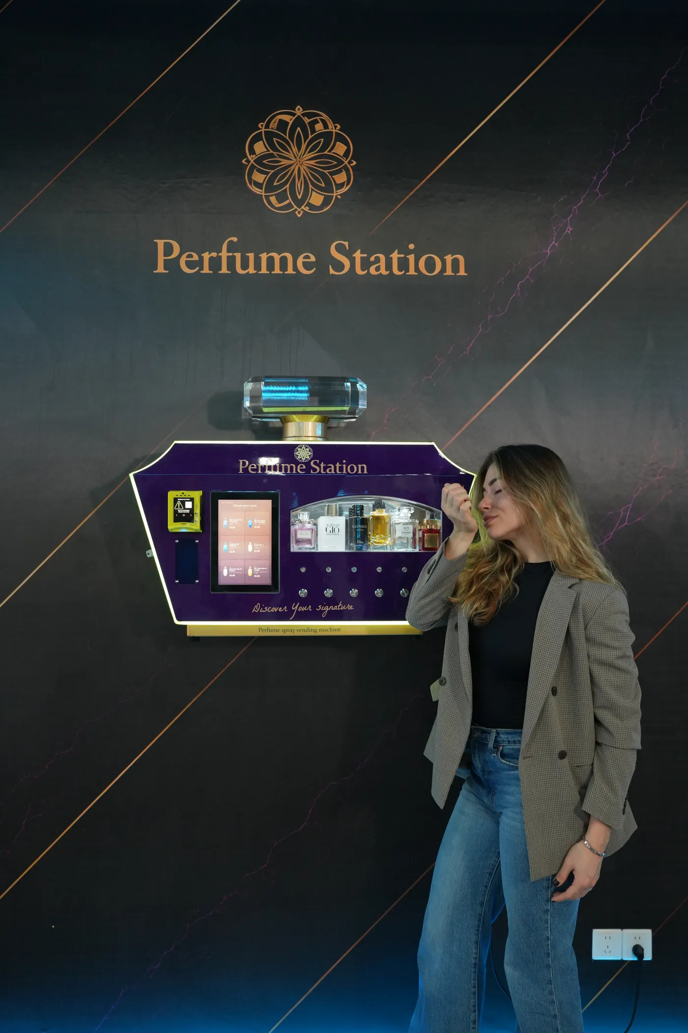 Customer smelling a fragrance sample at the Perfume Station