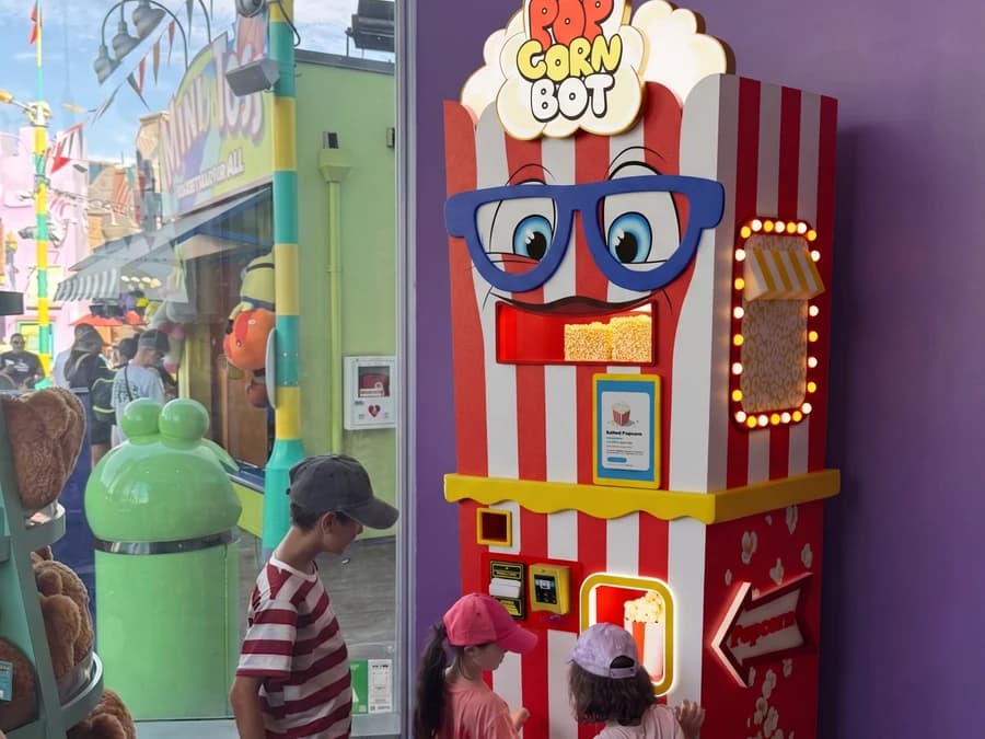 Popcorn Bot vending machine in a live venue, Futureino popcorn robot in action